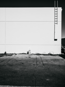 Minimal urban landscape photograph of architecture in black and white with a dramatic feel