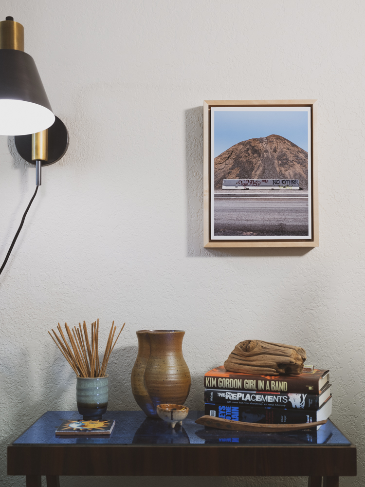 A Curtis Stage framed photograph in a room